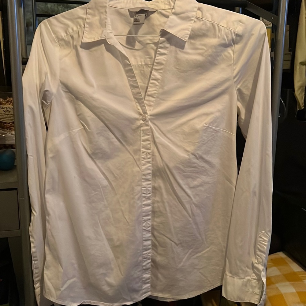 Woman’s white button down business attire